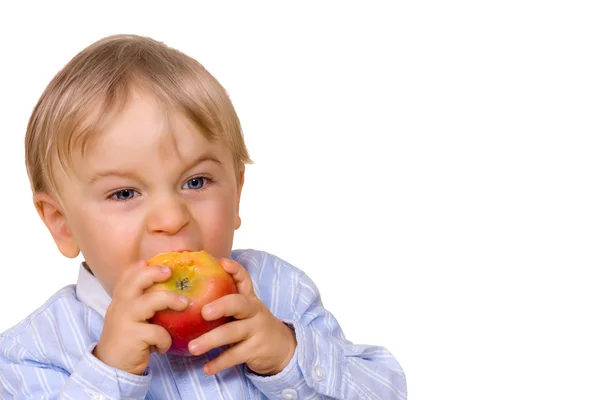 Young boy eating apple — Stock Photo, Image