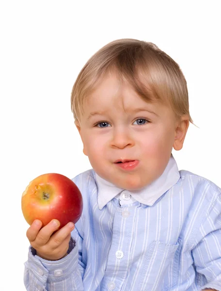 stock image Young boy eating apple