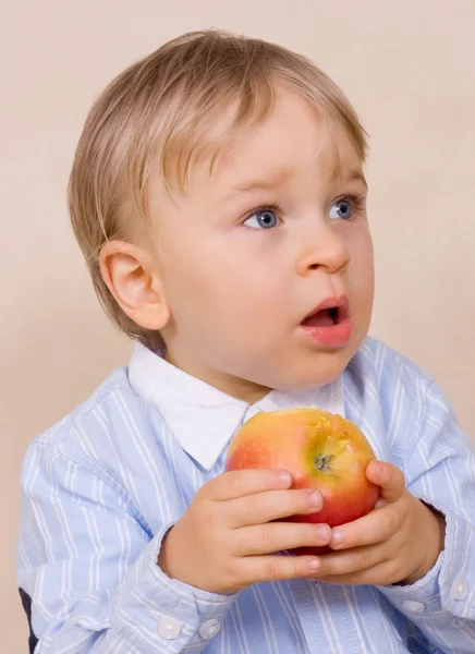 stock image Young boy eating apple