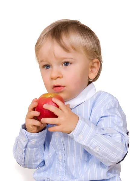 Young boy eating apple Stock Image