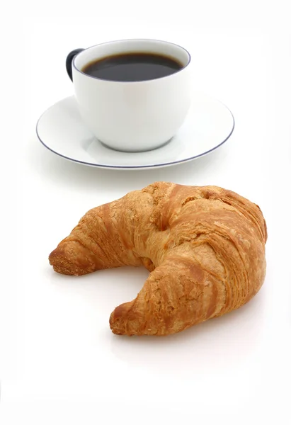 Croissant, šálek kávy Stock Fotografie