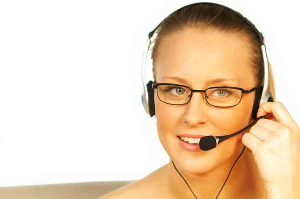 Young pretty woman wearing a phone headset. — Stock Photo, Image