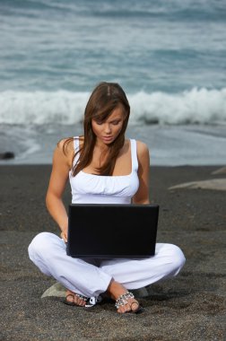 Woman on the Black Beach clipart