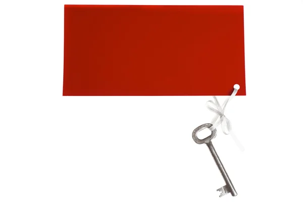 Alter Schlüssel mit rotem Etikett — Stockfoto
