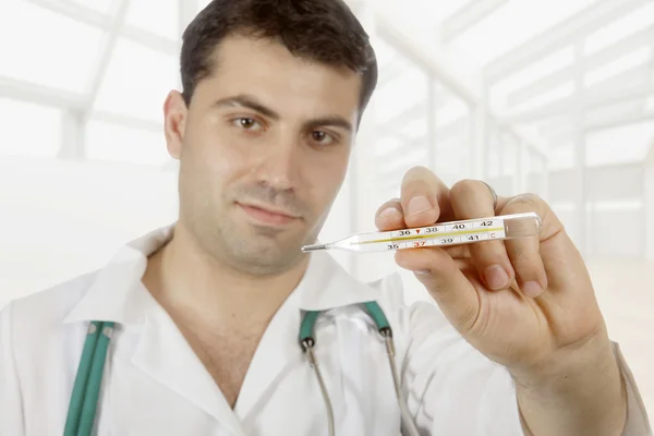 Medical doctor with thermometer — Stock Photo, Image