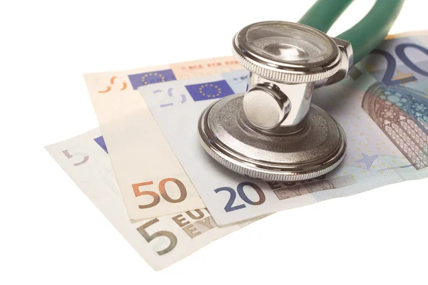 Stethoscope on the top of the money — Stock Photo, Image