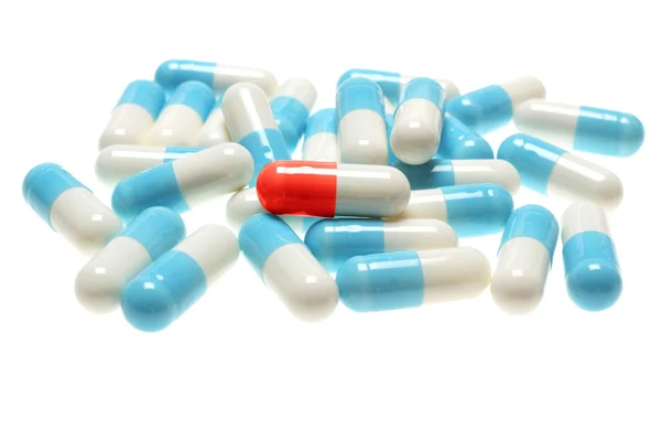 Pilules bleues sur fond blanc — Photo