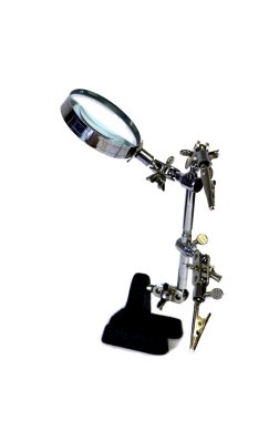 Magnifying glass - the assistant in work clipart
