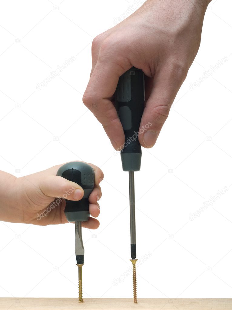 Two hands with screw-drivers