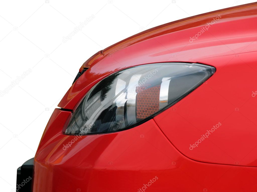 Headlight of the red car
