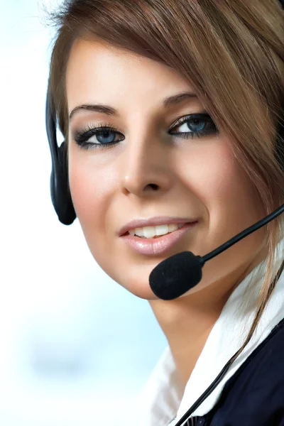Repräsentativ lächelnde Callcenter-Frau lizenzfreie Stockfotos