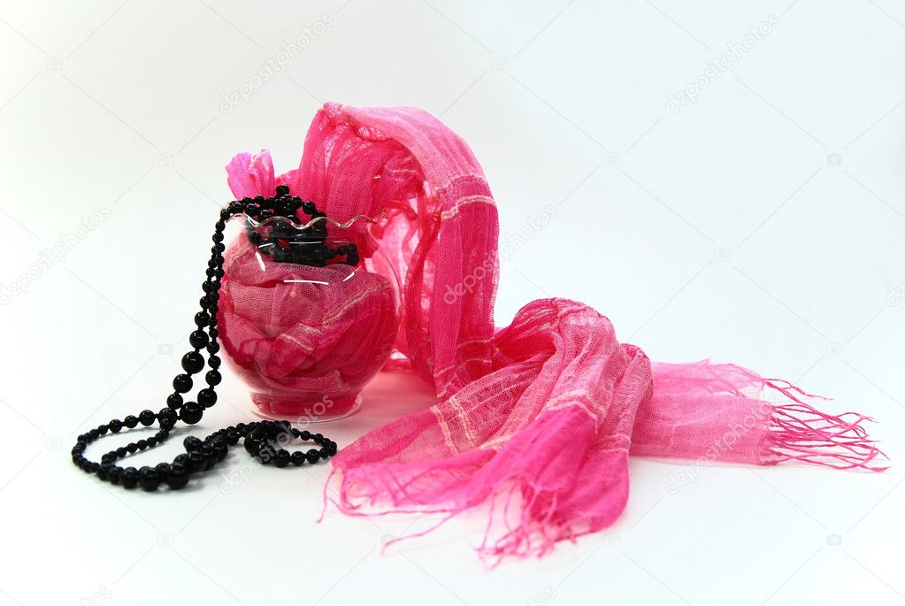 Pink scarf with black necklace on white