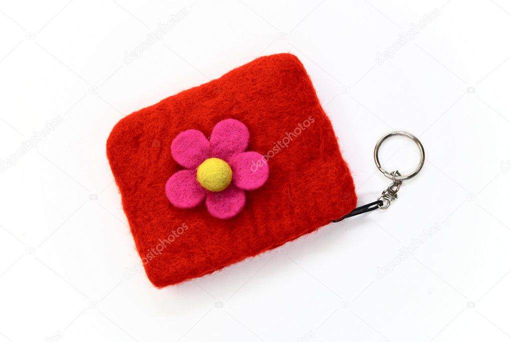 Red woolen purse on a white