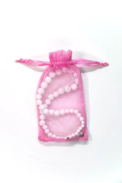 Small pink bag with pearl — Stock Photo, Image
