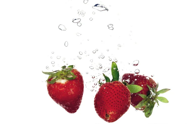 Strawberry splashing — Stock Photo, Image