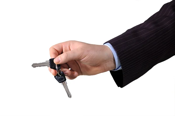 Mão com chave de desbloqueio — Fotografia de Stock