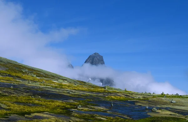 stock image Rock is in fluffy clouds.