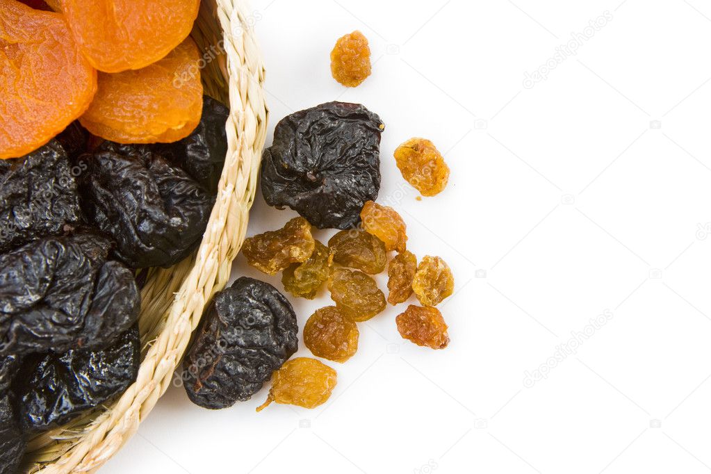 Dried fruit are in a small basket
