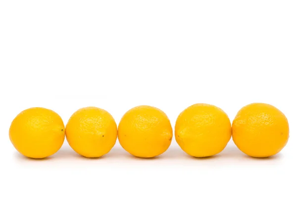 Arany citrom egy sorban — Stock Fotó