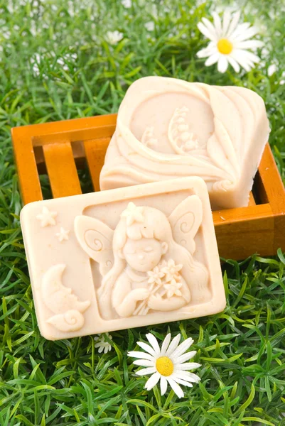 Handmade soap on green grass — Stock Photo, Image