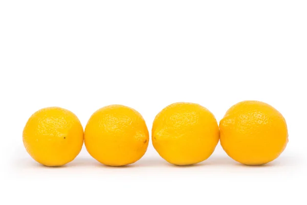 Limão dourado em uma fileira — Fotografia de Stock