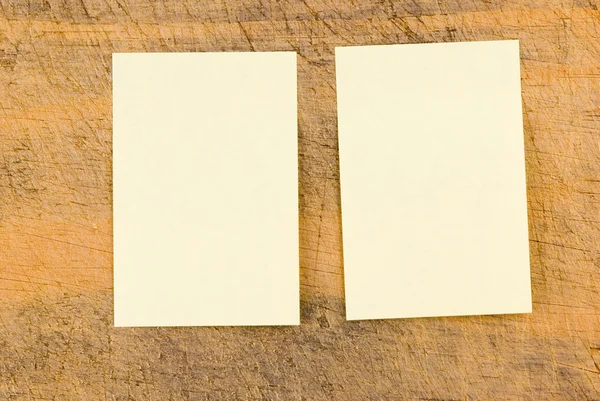 Yellow note paper on retro wood — Stock Photo, Image