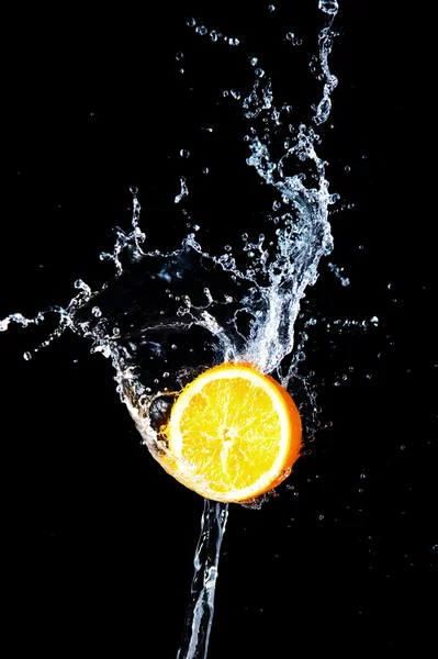 stock image Orange and waters splashes