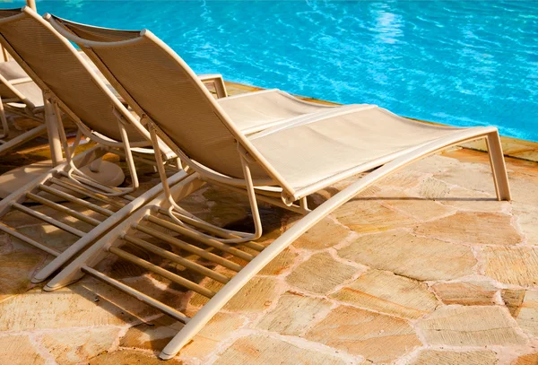 Two lounges near swimming pool — Stock Photo, Image