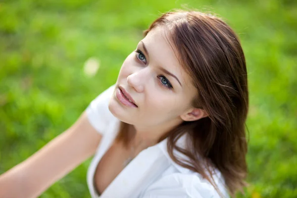 stock image Beautiful woman on the grass