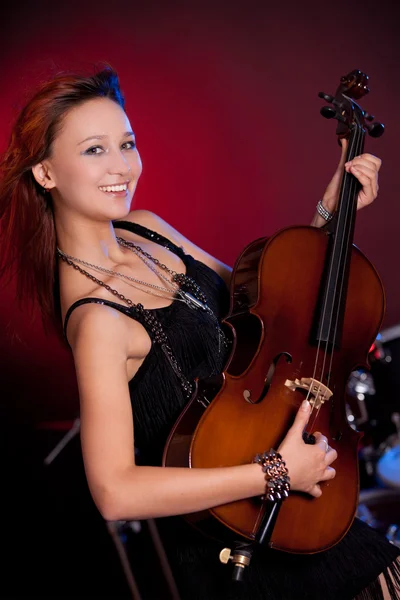 Hermosa mujer con instrumento musical — Foto de Stock