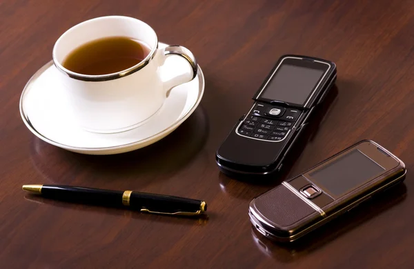 stock image Coffee tea pen and mobile phones