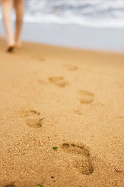 Footsteps on the beach two clipart