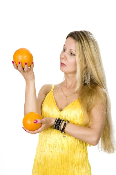 Woman with two oranges — Stock Photo, Image