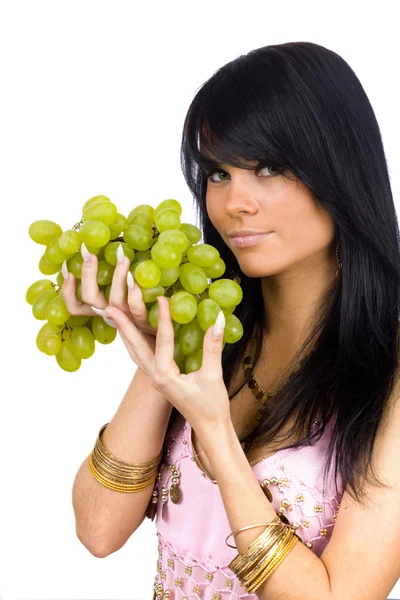 Brunette with bunch of grapes — Stock Photo, Image