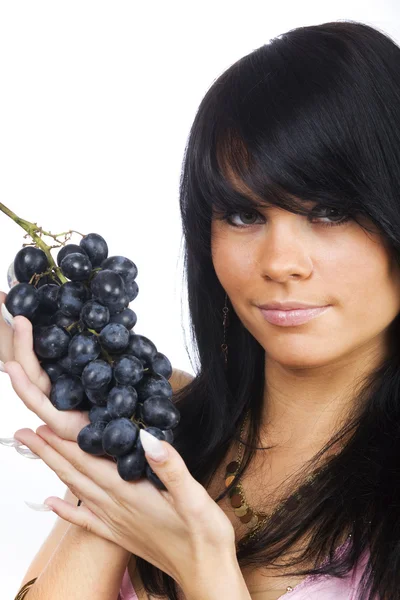 Brunette with green grapes Stock Photo