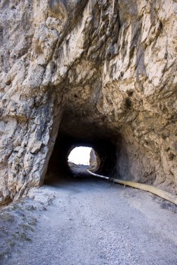 A tunnel is in a mountain clipart