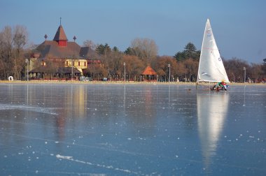 Sailing on frozen lake, winter, sport clipart