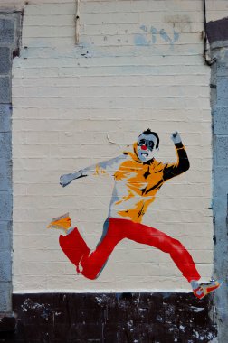 Graffiti of colorful clowns who run away clipart