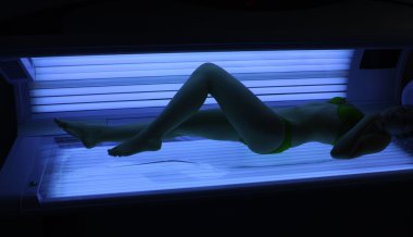 Girl in a solarium. clipart