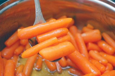 Stewed baby carrots clipart