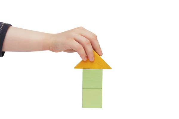 Child hand make a building with blocks — Stock Photo, Image