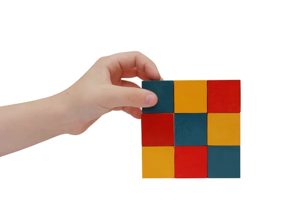 Child hand make a building of blocks — Stock Photo, Image