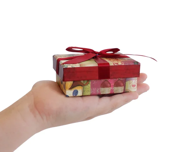 Child hand holding a gift box — Stock Photo, Image