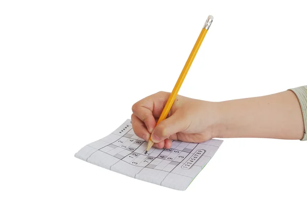 Bambino scrittura a mano sul gioco sudoku — Foto Stock