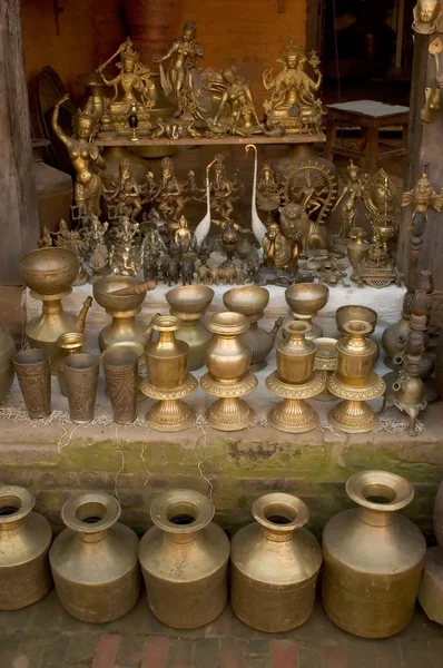 stock image Counter with bronze goods