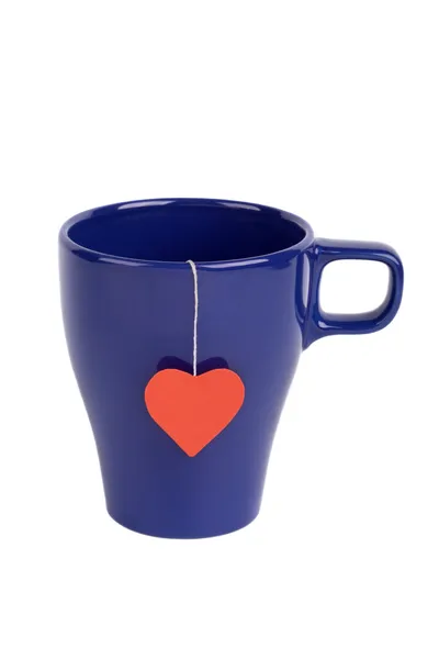 Tepåse med hjärtformade etikett i cupen — Stockfoto
