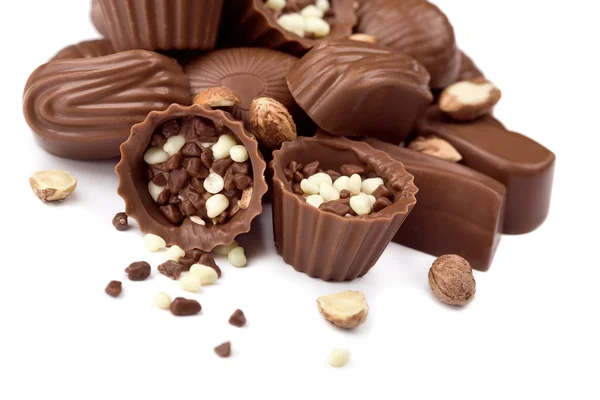 Assorted chocolate candies and nuts — Stock Photo, Image