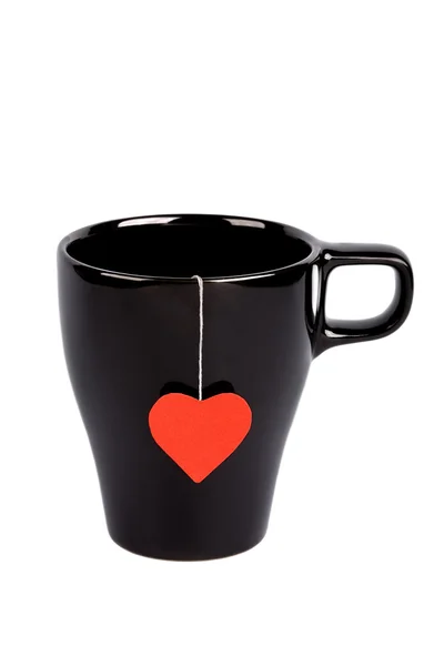 Saco de chá com rótulo em forma de coração no copo — Fotografia de Stock