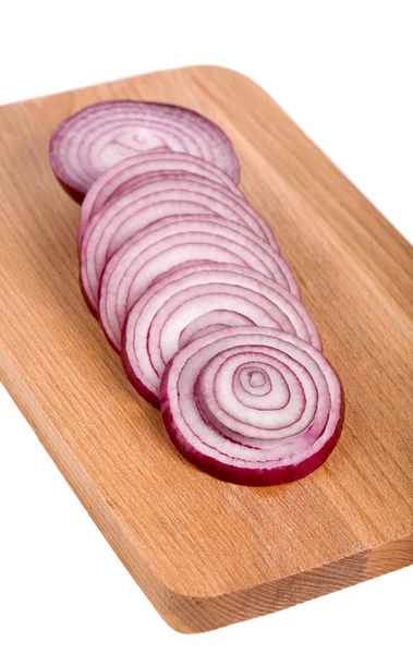 stock image Fresh onion slices on a wooden board