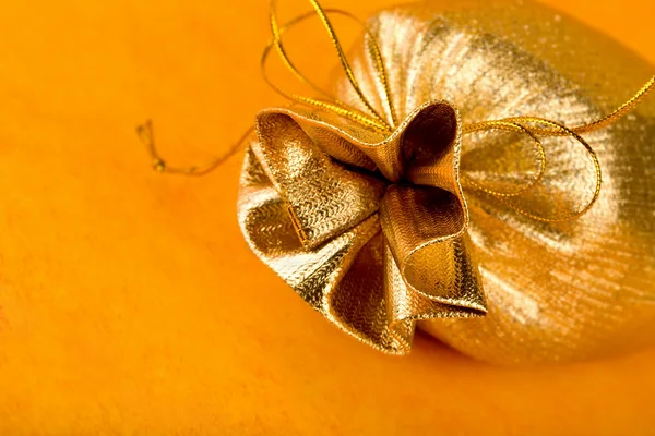 Golden gift sack — Stock Photo, Image